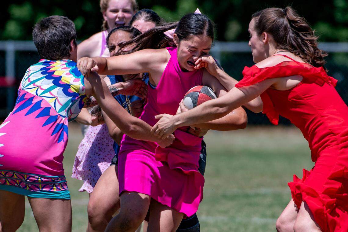 The NC State Women’s Rugby club hosts an annual prom dress game, just for fun. This year the Wolfpack played the Fayetteville Lady Valkyries women’s rugby at Method Fields in Raleigh. The attire may be formal, but the action is all rugby.