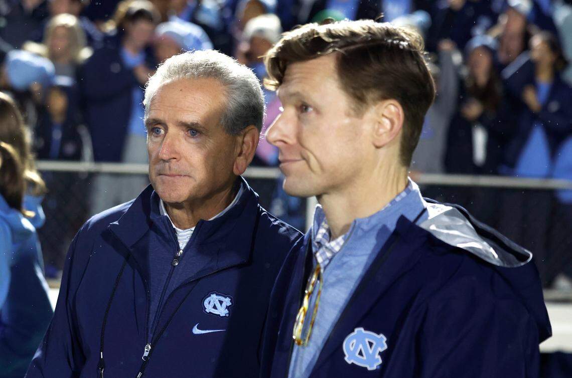 North Carolina athletics director Bubba Cunningham, left, stands next to Chancellor Lee Roberts after UNC’s 1-0 victory over Wake Forest in the finals of the 2024 Women’s College Cup at WakeMed Soccer Park in Cary, N.C., Monday, Dec. 9, 2024.