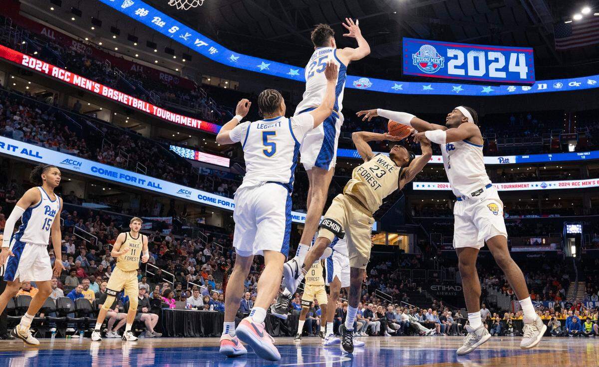 Pittsburgh’s Ishmael Leggett (5), Guillermo Diaz Graham (25) and Blake Hinson (2) defend Wake Forest’s Hunter Sallis (23) in the second half during the quarterfinals of the ACC Men’s Basketball Tournament at Capitol One Arena on Wednesday, March 13, 2024 in Washington, D.C.