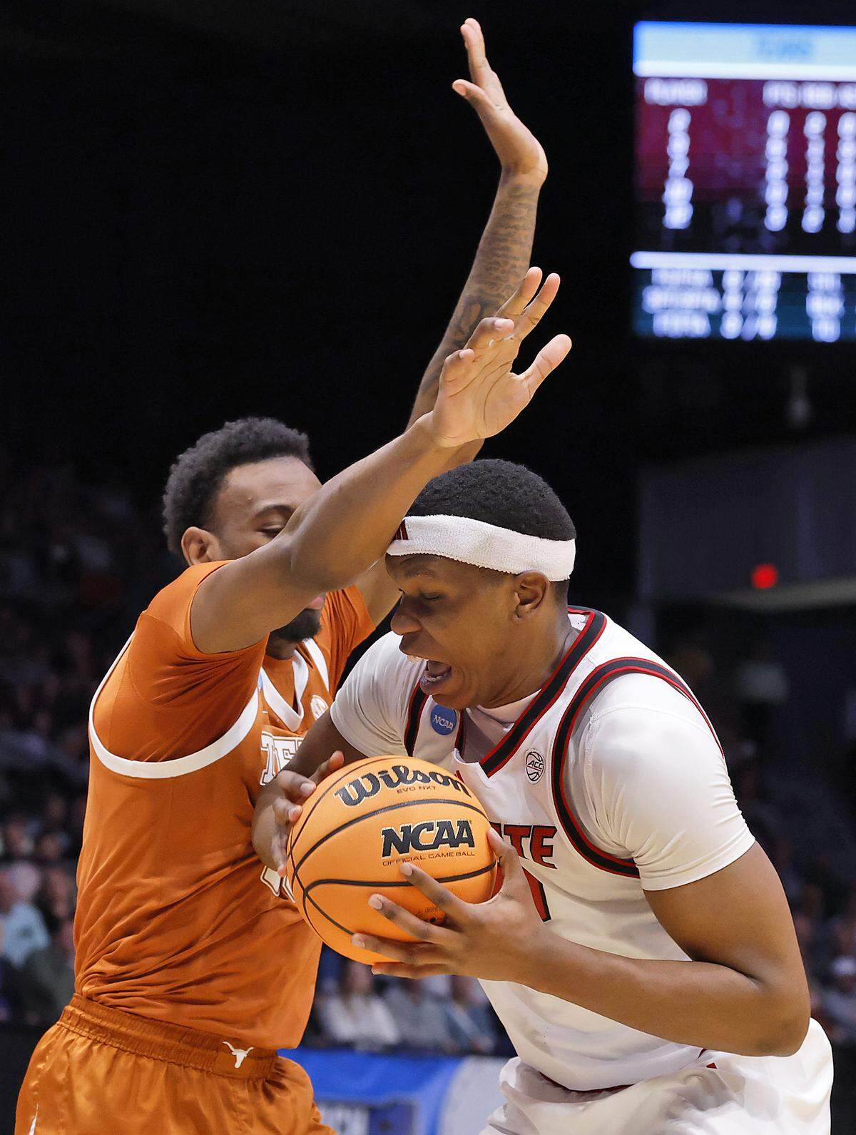Texas’ Nic Codie pressures N.C. State’s Ven-Allen Lubin during the first half of the Wolfpack’s 68-66 loss in the NCAA First Four on Tuesday, March 17, 2026, at the University of Dayton Arena in Dayton, Ohio. 