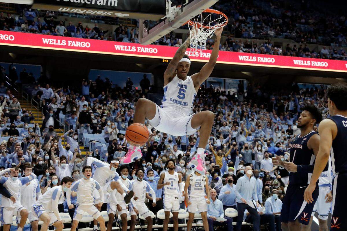 North Carolina forward Armando Bacot (5) goes in for a dunk against Virginia during the second half of an NCAA college basketball game Saturday, Jan. 8, 2022, in Chapel Hill, N.C.