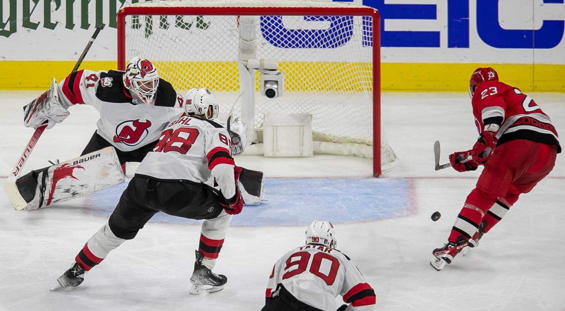 The Carolina Hurricanes Stefan Noesen (23) scores on New Jersey Devils Vivek Vanecek (41) to cap a 6-1 victory in the third period during Game 2 of their second round Stanley Cup playoff series on Friday, May 5, 2023 at PNC Arena in Raleigh, N.C.
