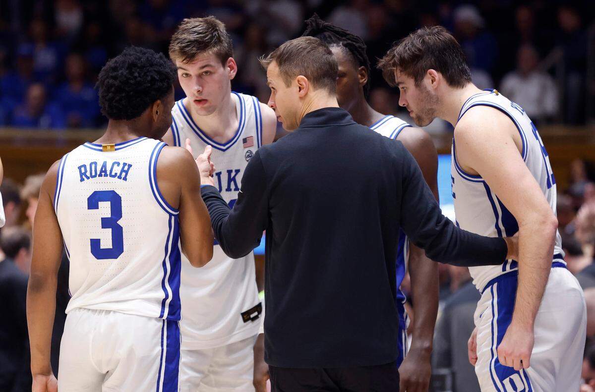 Duke head coach Jon Scheyer talks with his team including Jeremy Roach (3), Kyle Filipowski (30), Mark Mitchell (25) and Ryan Young (15) during the second half of Duke’s 75-73 victory over Wake Forest at Cameron Indoor Stadium in Durham, N.C., Tuesday, Jan. 31, 2023.