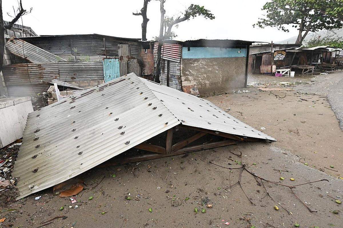 A torn off roof is seen in St. Catherine, Jamaica, on October 28, 2025. Ferocious winds and torrential rain tore into Jamaica Tuesday as Hurricane Melissa made landfall, the worst storm ever to strike the island nation and one of the most powerful hurricanes on record. The extremely violent Category 5 system was still crawling across the Caribbean, promising catastrophic floods and life-threatening conditions as maximum sustained winds reached a staggering 185 miles per hour (295 kilometers per hour). (Photo by Ricardo Makyn / AFP) (Photo by RICARDO MAKYN/AFP via Getty Images)