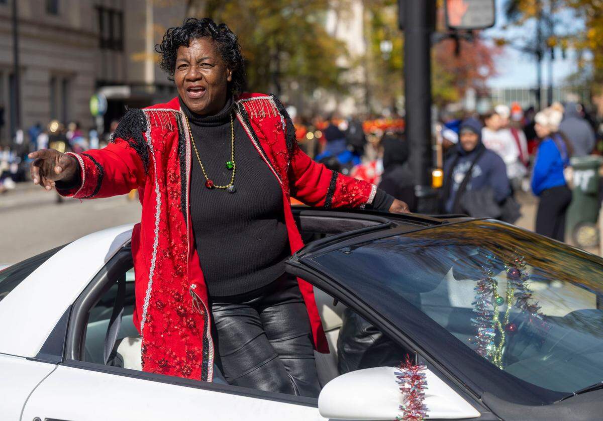 Helping Hand Mission director Sylvia Wiggins leads the mission’s marching band during the 80th annual Raleigh Christmas Parade on Saturday, November 23, 2024 in Raleigh, N.C.
