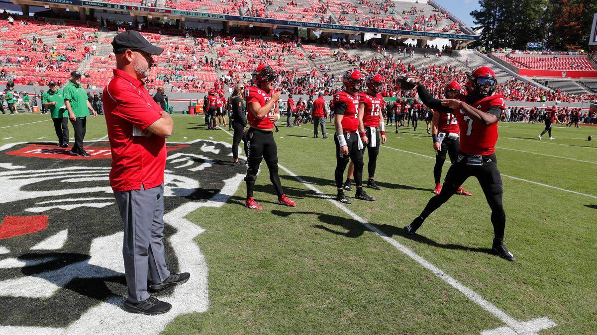 N.C. State quarterbacks coach Kurt Roper watches warmups before the Wolfpack’s game against Marshall at Carter-Finley Stadium in Raleigh, N.C., Saturday, Oct. 7, 2023.