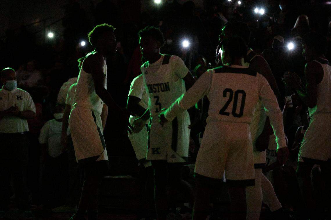 Kinston Vikings players are introduced to a large crowd under green lights before the start of their game against their rival, Farmville Central, at the Brandon Ingram MLK Showcase in Kinston, N.C. on Saturday, Jan. 15, 2022.