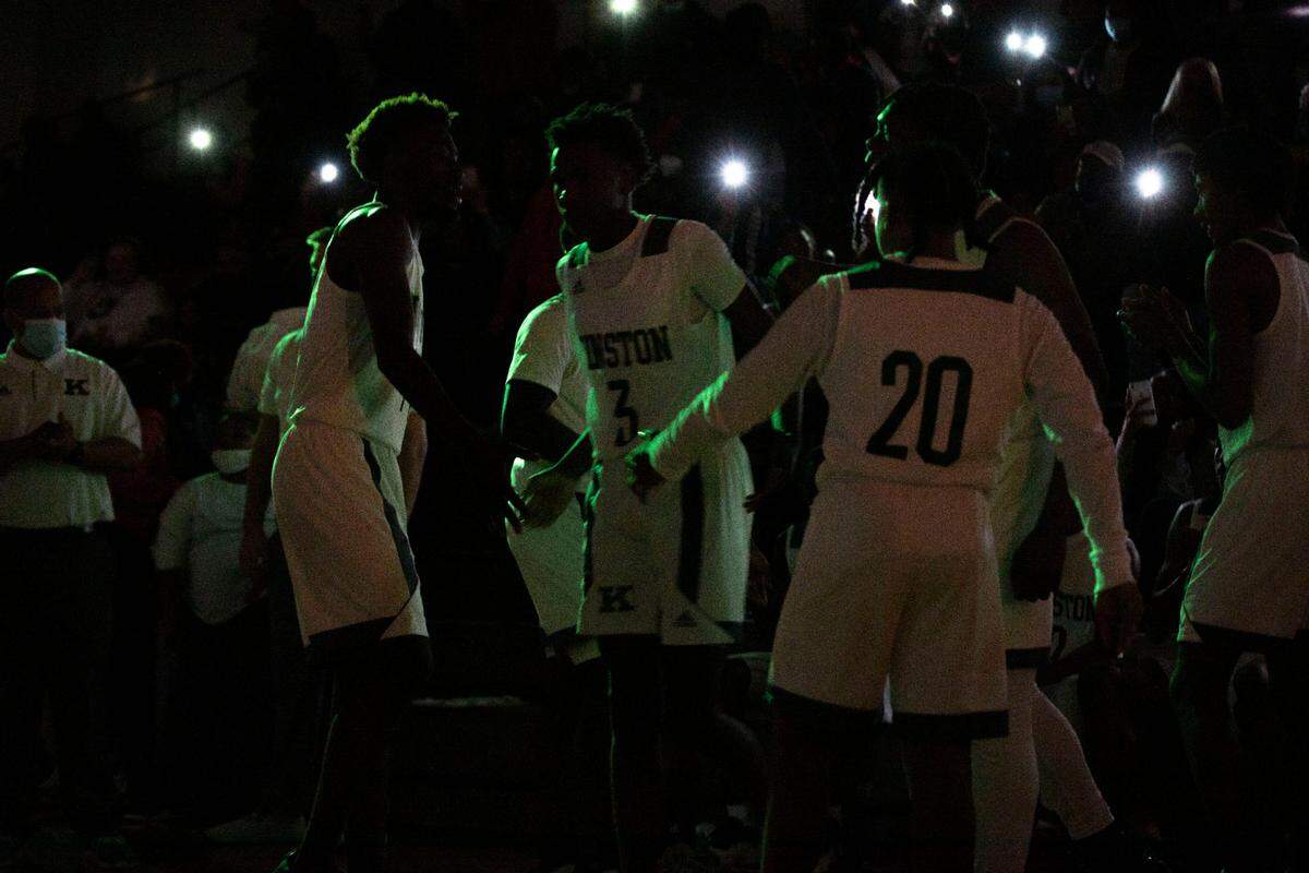 Kinston Vikings players are introduced to a large crowd under green lights before the start of their game against their rival, Farmville Central, at the Brandon Ingram MLK Showcase in Kinston, N.C. on Saturday, Jan. 15, 2022.