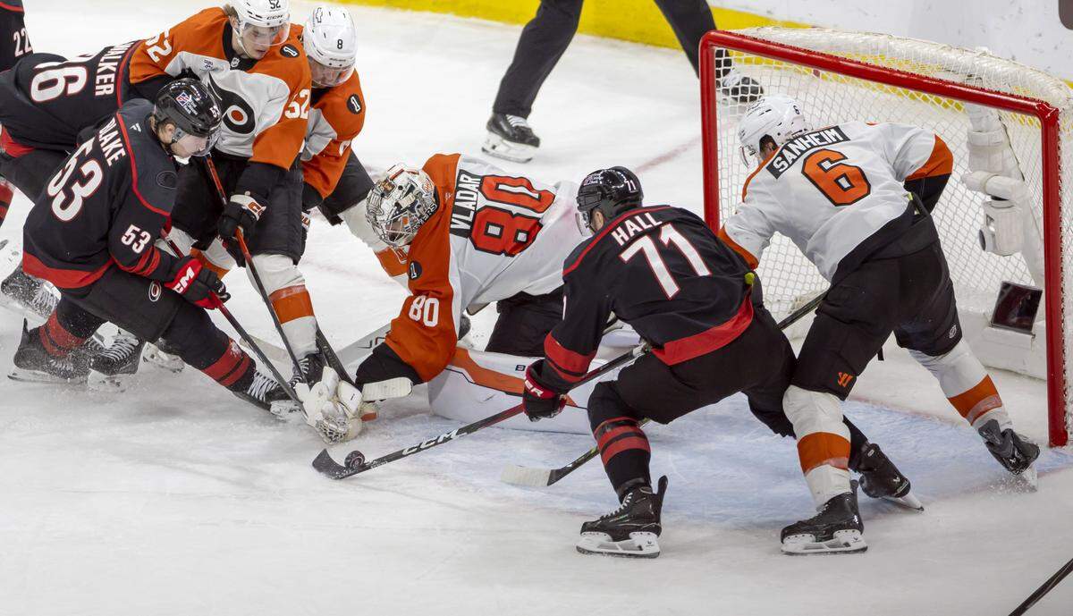 Carolina Hurricanes left wing Taylor Hall (71) scores the game winning goal on Philadelphia goalie Dan Vladar (80), to secure a 3-2 overtime victory, in Game 2 on Monday, May 4, 2026, during the second round of the Stanley Cup Playoffs at Lenovo Center in Raleigh, N.C.