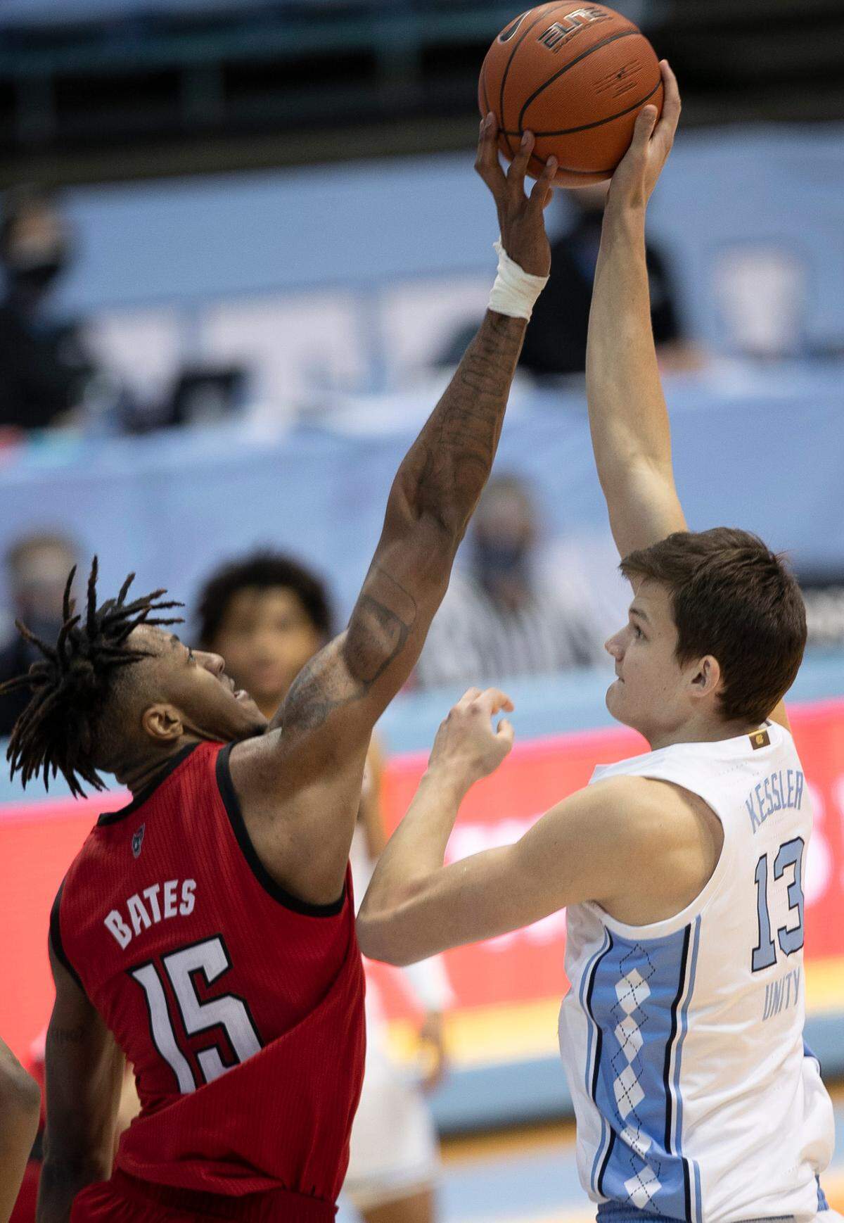 N.C. State’s Manny Bates (15) blocks a shot by North Carolina’s Walker Kessler (13) in the second half on Saturday, January 23, 2021 at the Smith Center in Chapel Hill, NC.