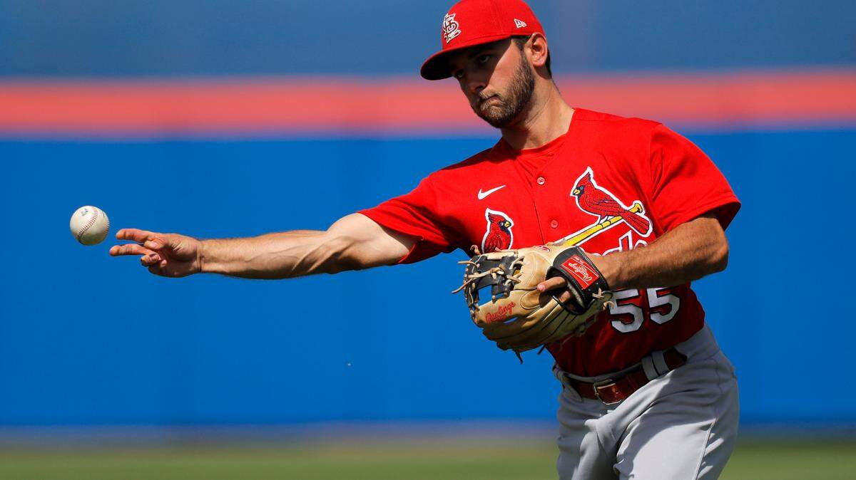 St. Louis Cardinals infielder Max Schrock throws out New York Mets’ Matt Adams at first base during the third inning of a spring training baseball game, Wednesday, March 11, 2020, in Port S. Lucie, Fla. (AP Photo/Julio Cortez)