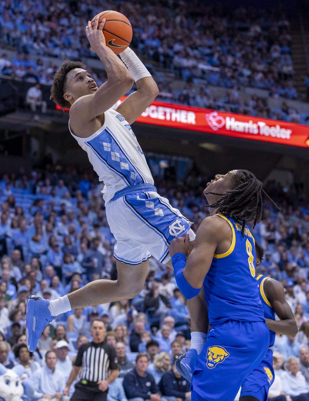North Carolina guard Seth Trimble (7) drives to the basket against Pitt guard Omari Witherspoon (8) in the first half on Saturday, February 14, 2026 at the Smith Center in Chapel Hill, N.C.
