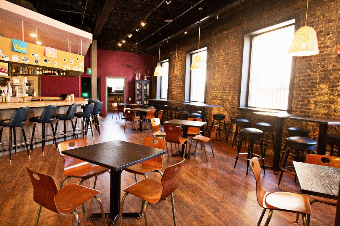 Queeny’s in downtown Durham has a dining room, full bar and a small reading room filled with books on Tuesday, Nov. 23, 2021.