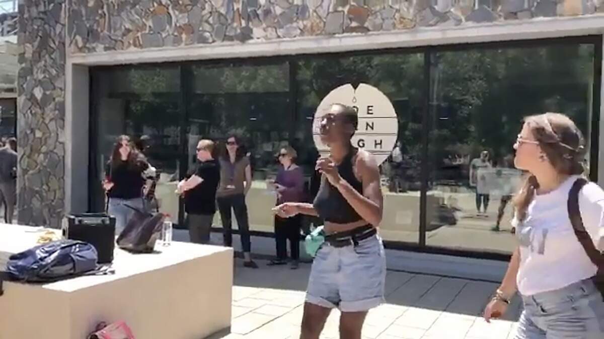 Protesters gathered at the Joe Van Gogh coffee shop on Duke's campus in support of two baristas who were fired after a complaint from Duke Vice President of Student Affairs Larry Moneta.