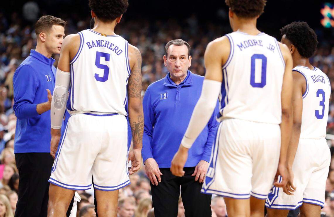 Duke head coach Mike Krzyzewski talks with his team during the first half of Dukes game against UNC in the Final Four at Caesars Superdome in New Orleans, La., Saturday, April 2, 2022.
