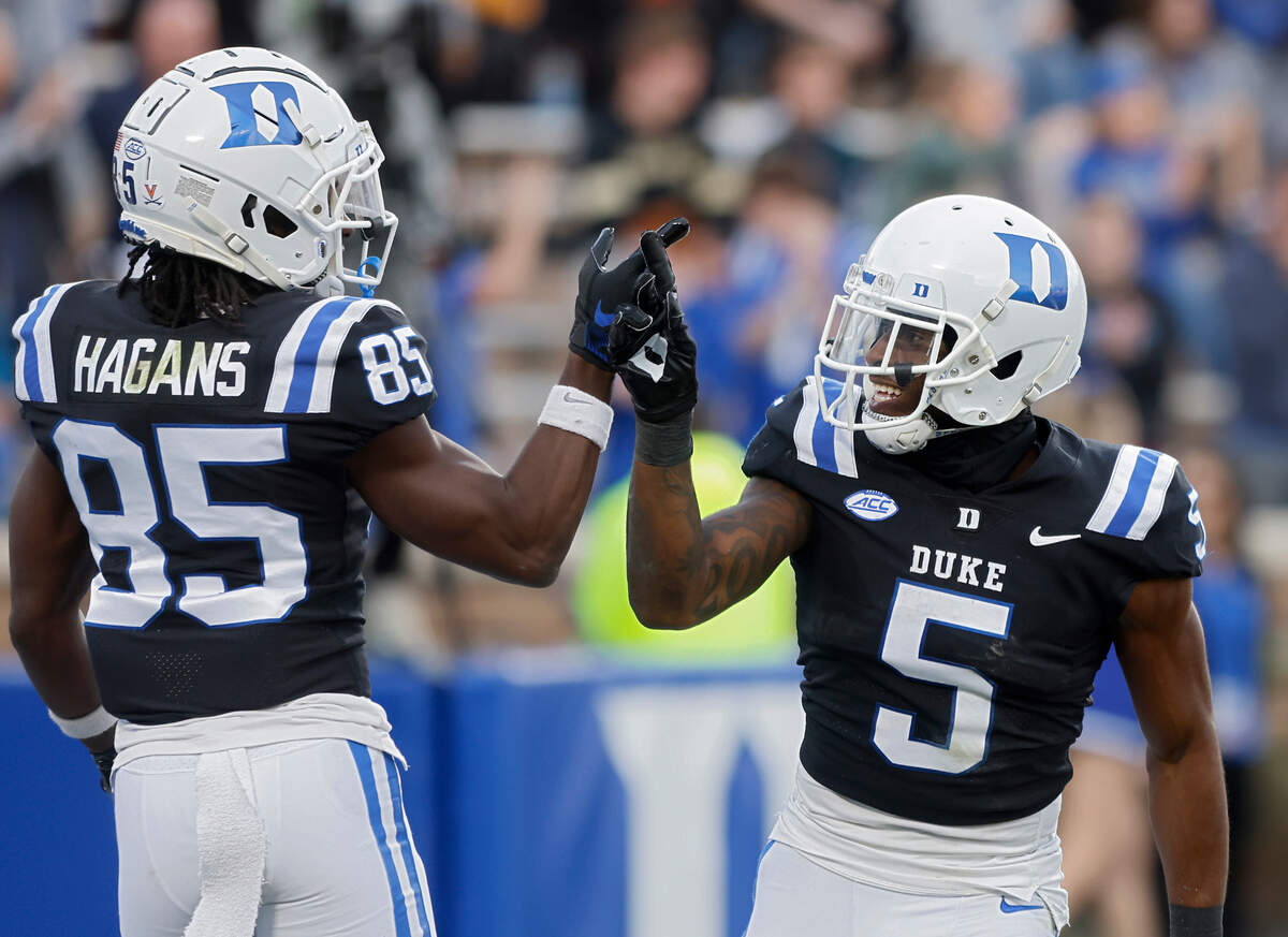 Duke’s Jalon Calhoun, right, celebrates with Sahmir Hagans after scoring a touchdown during the first half of the Blue Devils’ final regular season game against Wake Forest at Wallace Wade Stadium on Saturday, Nov. 26, 2022, in Durham, N.C.