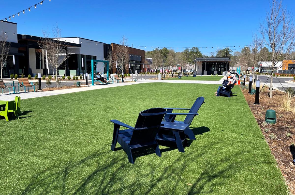 The Commons, a 30,000 square foot lawn with seating and bench swings, is now open at University Place mall in Chapel Hill. The space could be used for gathering, events, and future fitness classes, Ram Realty Advisor officials have said.