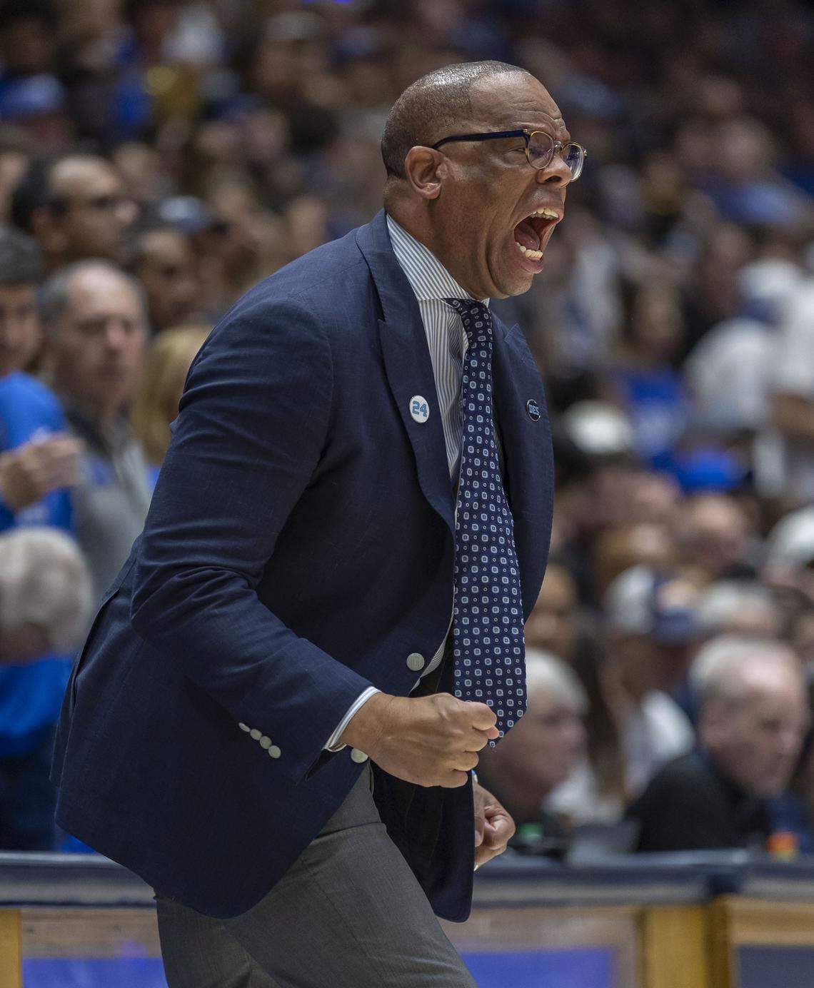 North Carolina coach Hubert Davis yells as his team on defense in the first half against Duke on Saturday, March 7, 2026 at Cameron Indoor Stadium in Durham, N.C.