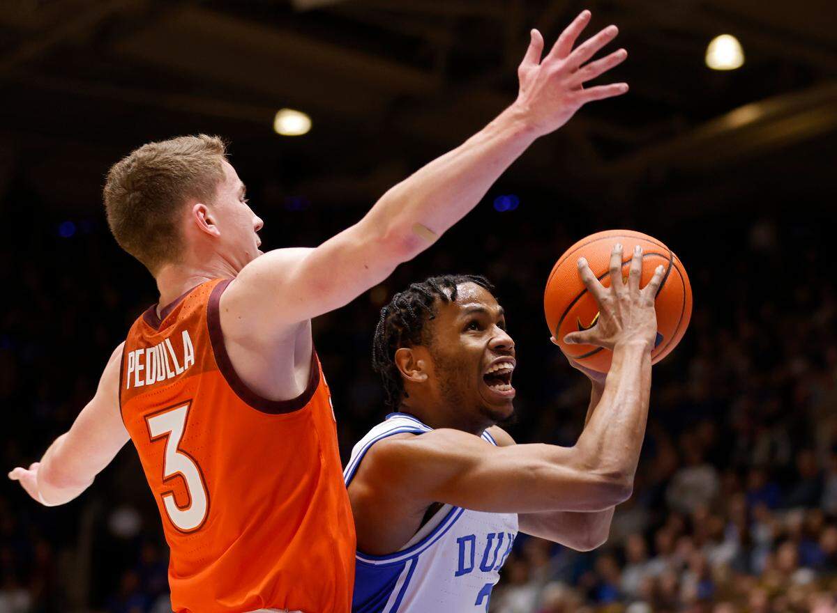 Duke’s Jeremy Roach drives past Virginia Tech’s Sean Pedulla during the first half of the Blue Devils’ game against Virginia Tech on Saturday, Feb. 25, 2023, at Cameron Indoor Stadium in Durham, N.C.