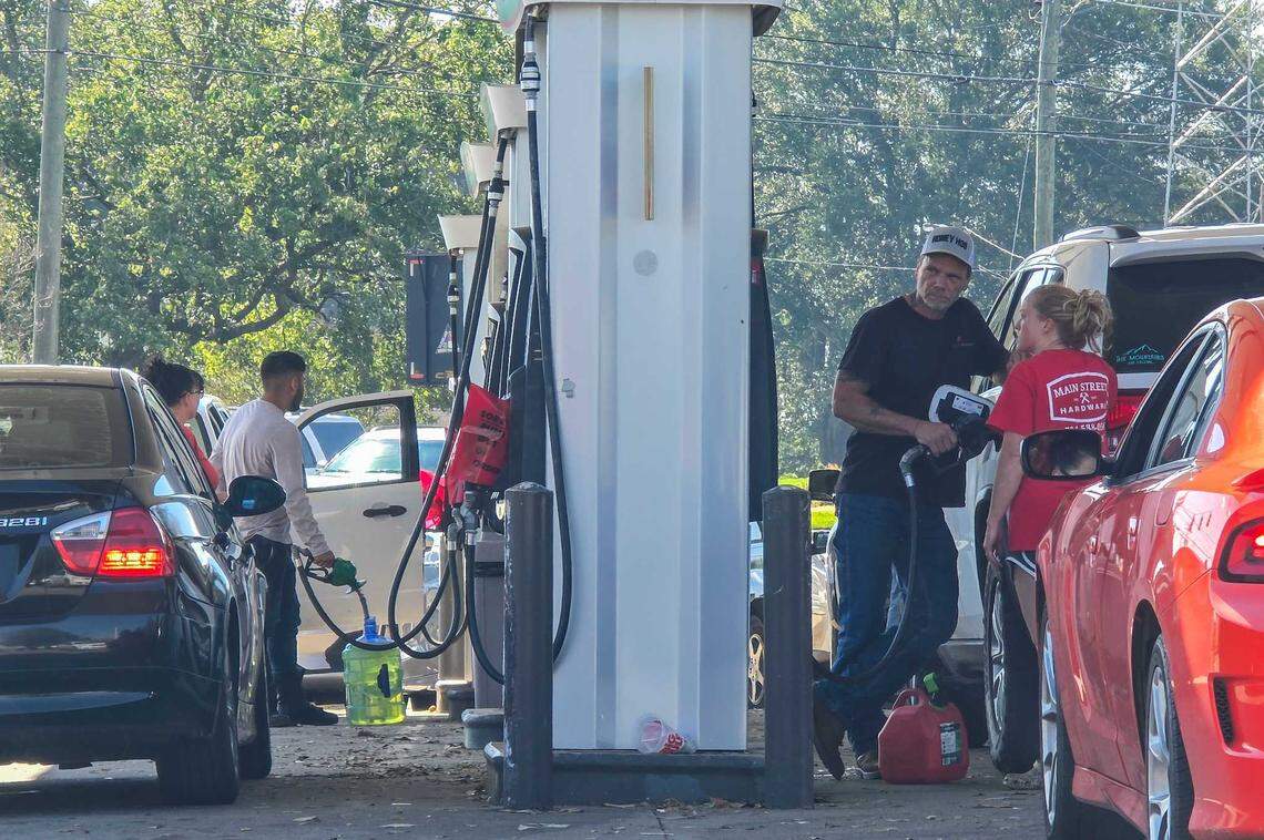 Vehicles line up to get gas at a 7 Eleven in Shelby on Saturday, Sept. 28, 2024