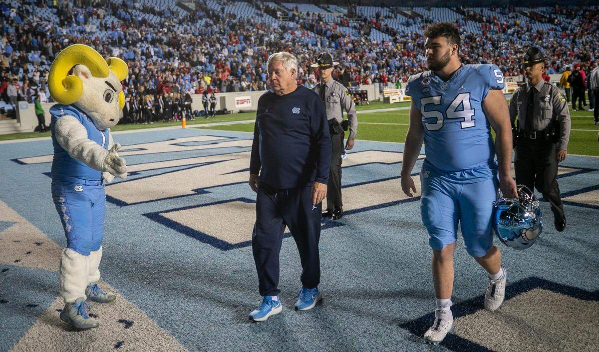 North Carolina coach Mack Brown leaves the field following the Tar Heels’ 30-27 loss to N.C. State on Friday, November 25, 2022 at Kenan Stadium in Chapel Hill, N.C.
