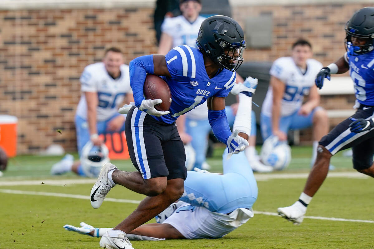 Duke Blue Devils wide receiver Jontavis Robertson (1) runs back a punt return against the North Carolina Tar Heels during the second half at Wallace Wade Stadium. 