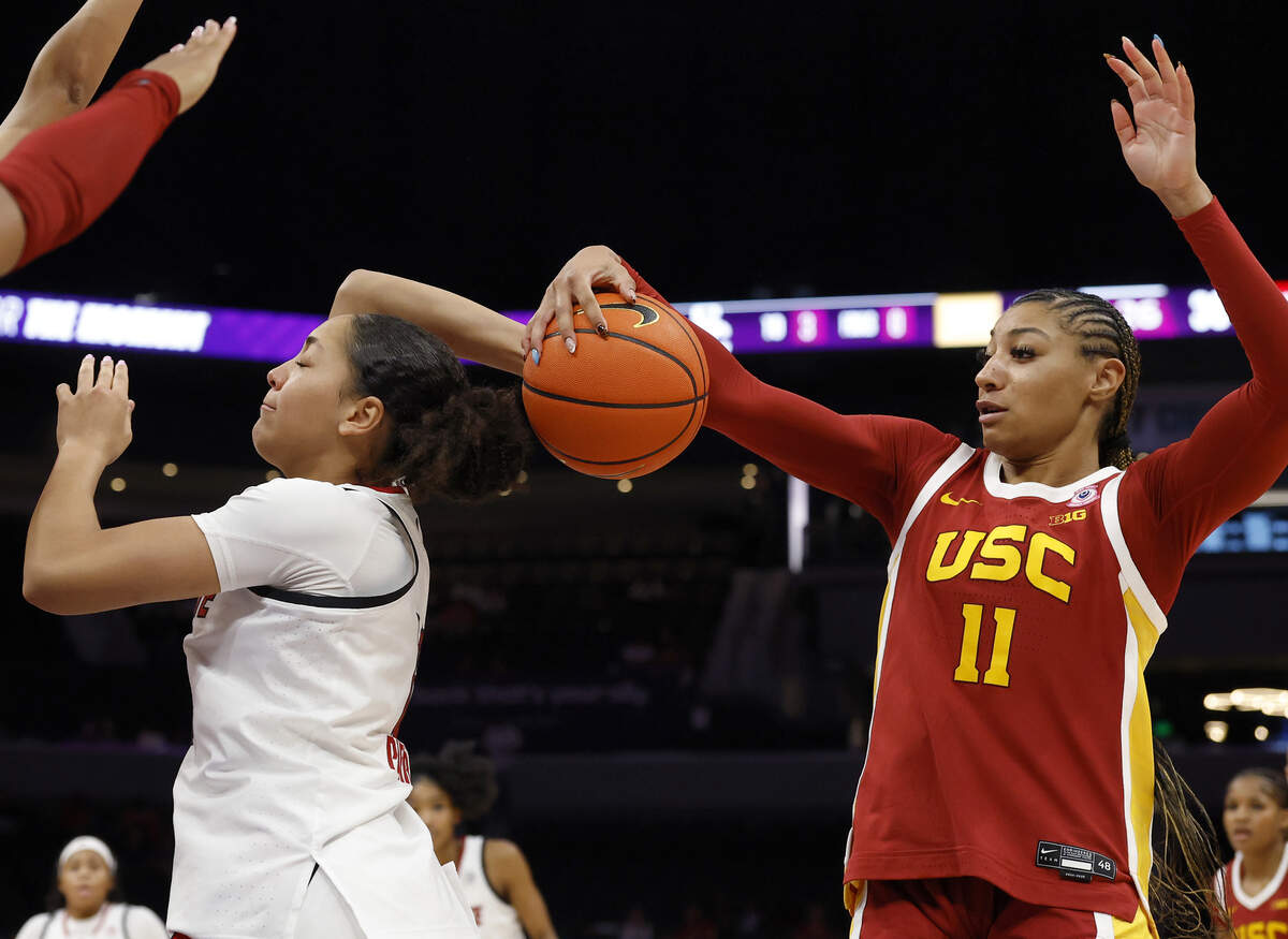 Southern California’s Kennedy Smith defends N.C. State’s Khamil Pierre during the second half of the Wolfpack’s 69-68 loss in the Ally Tipoff game on Sunday, Nov. 9, 2025, at Spectrum Center in Charlotte, N.C.