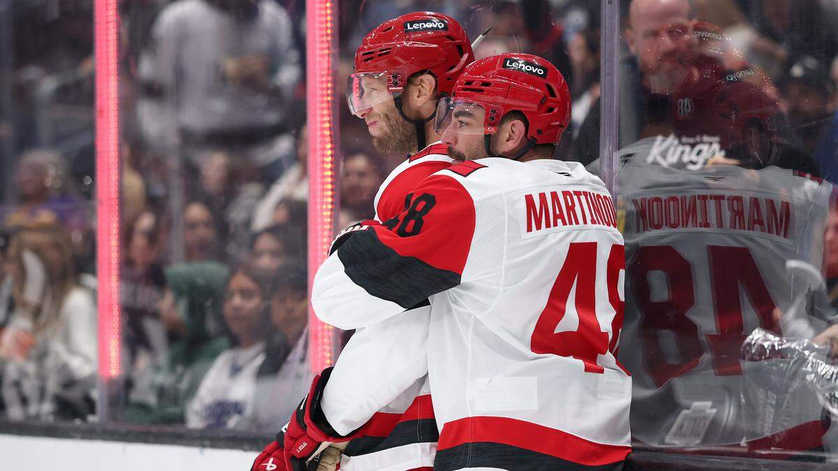 Jordan Staal (11) and Jordan Martinook (48) of the Carolina Hurricanes celebrate one of Staal’s two goals in a 4-3 win over the Los Angeles Kings on Sunday.