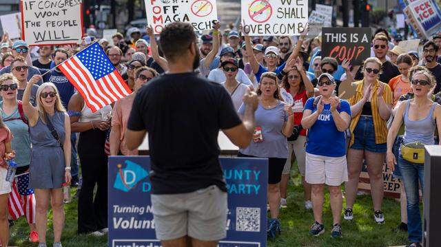 Wake County Democratic Party chair Wesley Knott, center, faced calls to resign after supporting a Democratic challenger over an incumbent in the 2026 primary election. Convention delegates voted on Saturday to keep him as chair.