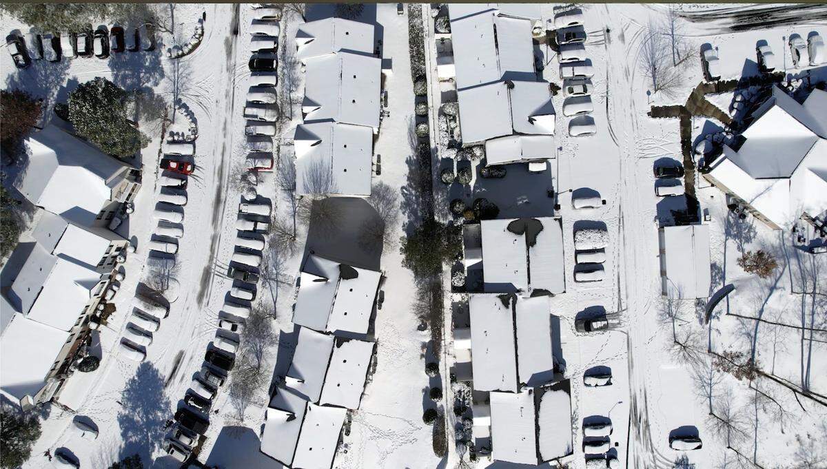 An aerial view of a snow-covered neighborhood in Raleigh, Sunday, Feb. 1, 2026.