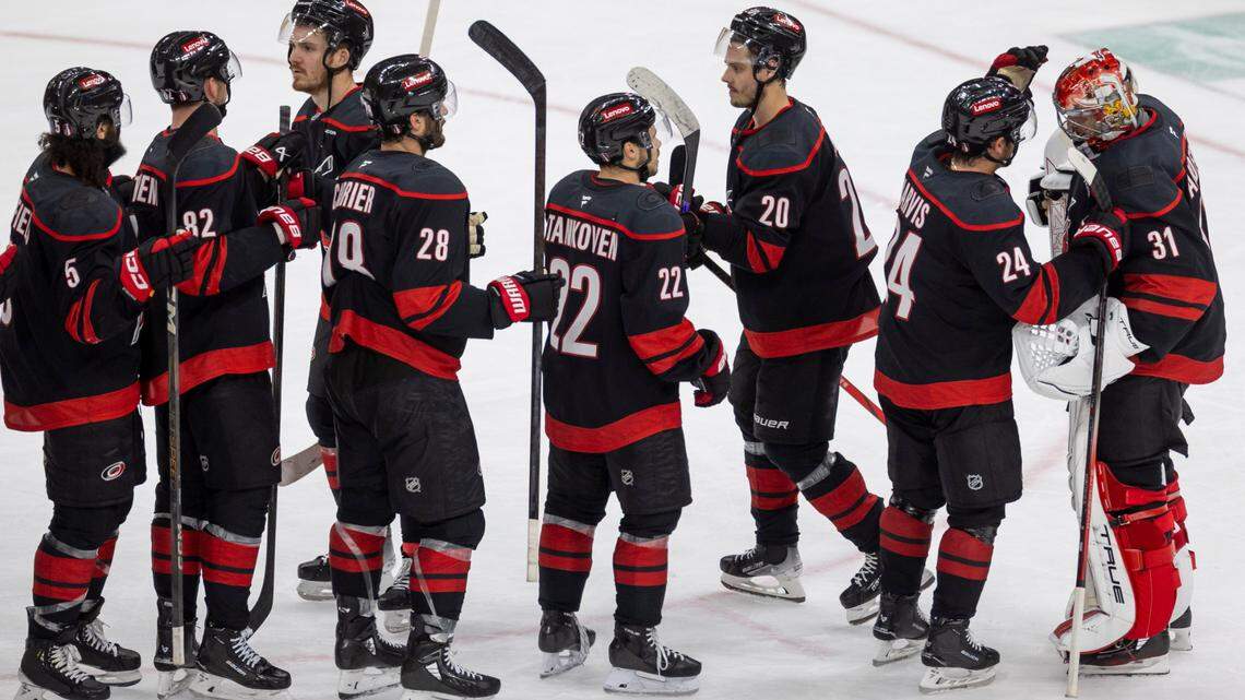 Carolina Hurricanes center Seth Jarvis (24) and his teammates congratulates goalie Frederik Andersen (31) following the Hurricanes 4-0 victory over the Washington Capital in Game 3 of their series on Saturday, May 10, 2025 at Lenovo Center in Raleigh, N.C.