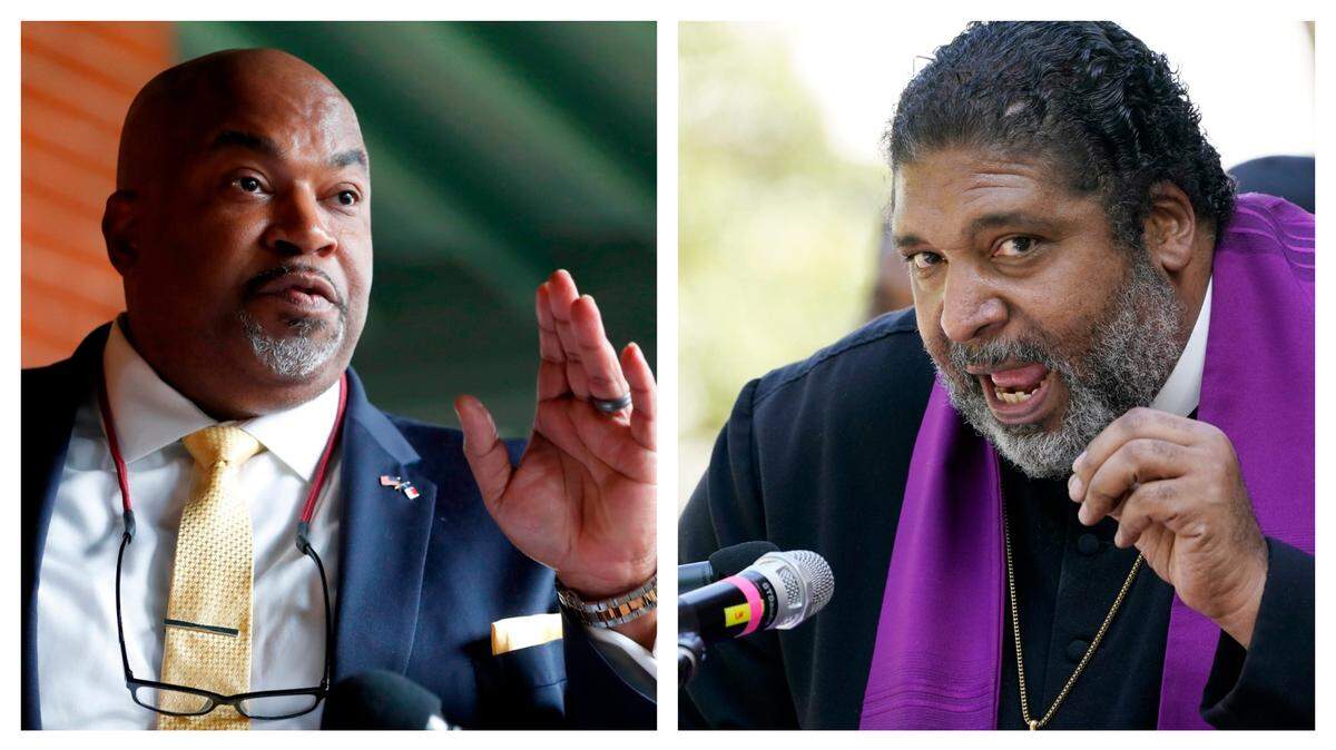 NC Lt. Gov. Mark Robinson, left, and Rev. William Barber II.