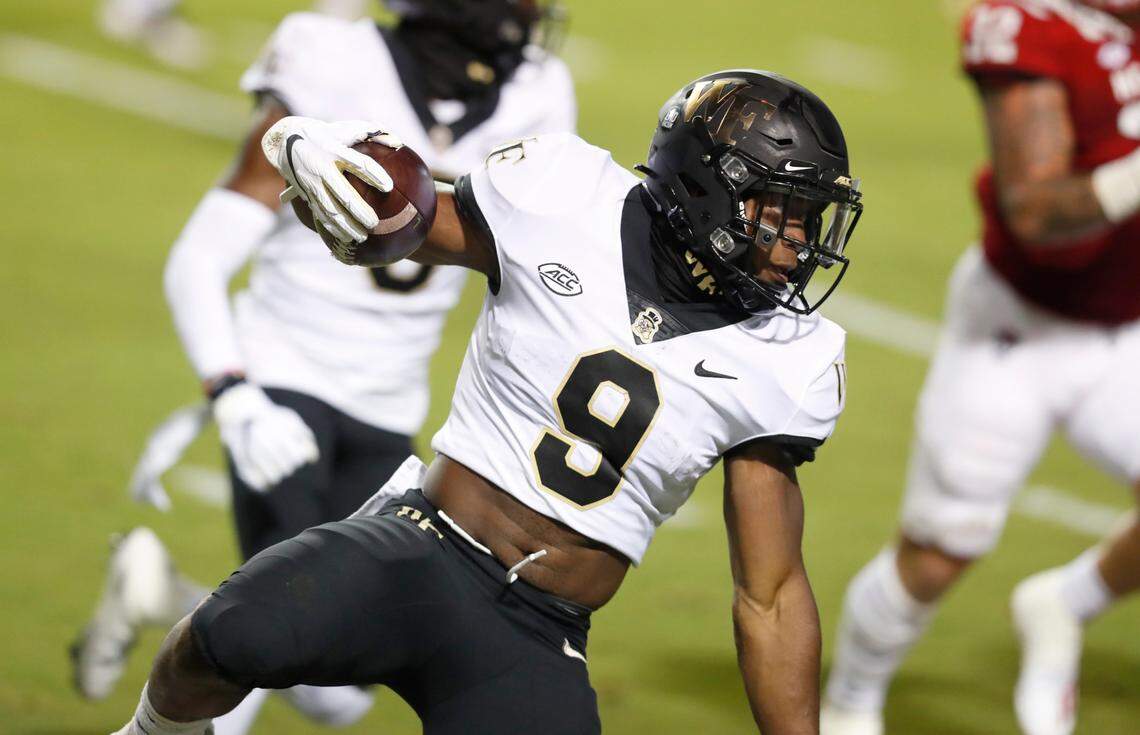 Wake Forest running back Kenneth Walker III (9) looks for yards during the first half of N.C. State’s game against Wake Forest at Carter-Finley Stadium in Raleigh, N.C, Saturday, Sept. 19, 2020.