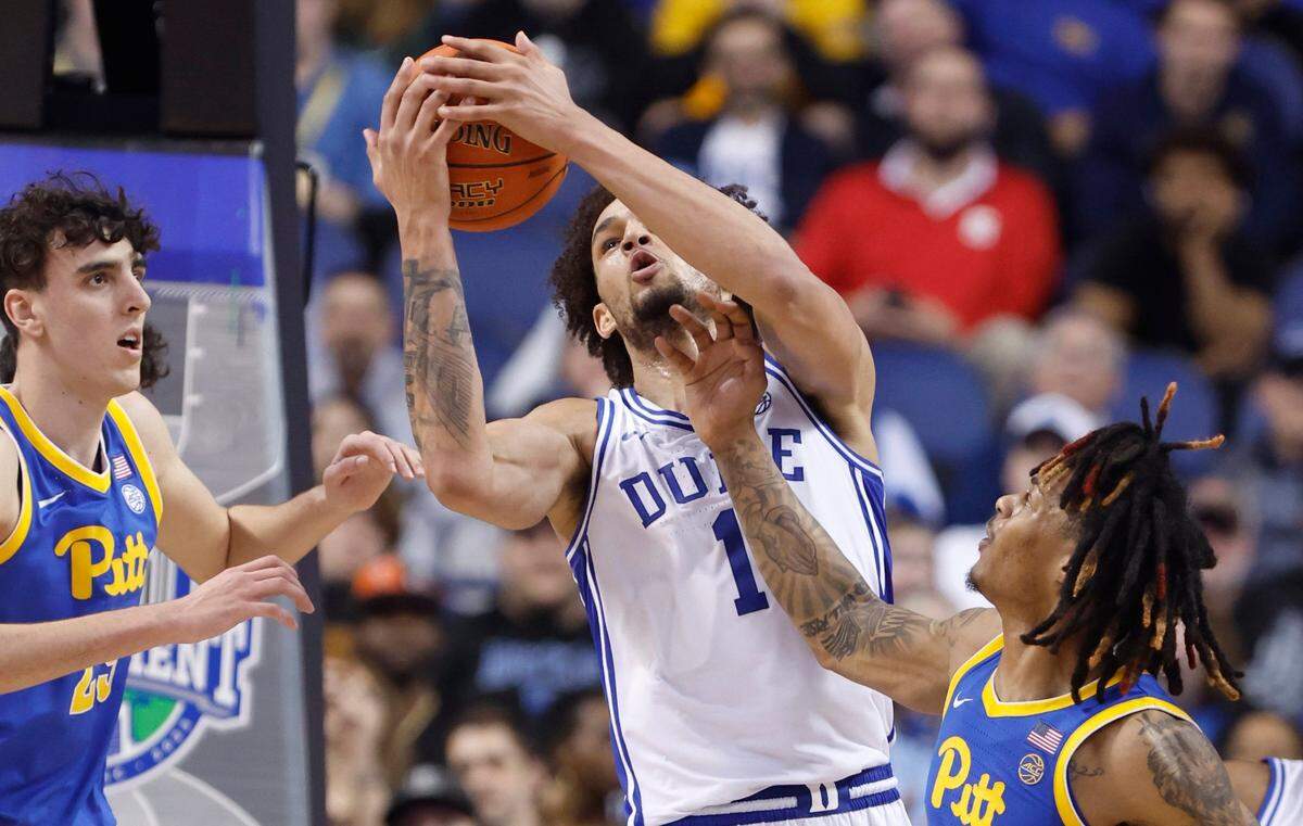 Duke’s Dereck Lively II (1) pulls in a rebound from Pittsburgh’s Nike Sibande (22) during the first half of Duke’s game against Pitt in the quarterfinals of the ACC Men’s Basketball Tournament in Greensboro, N.C., Thursday, March 9, 2023.