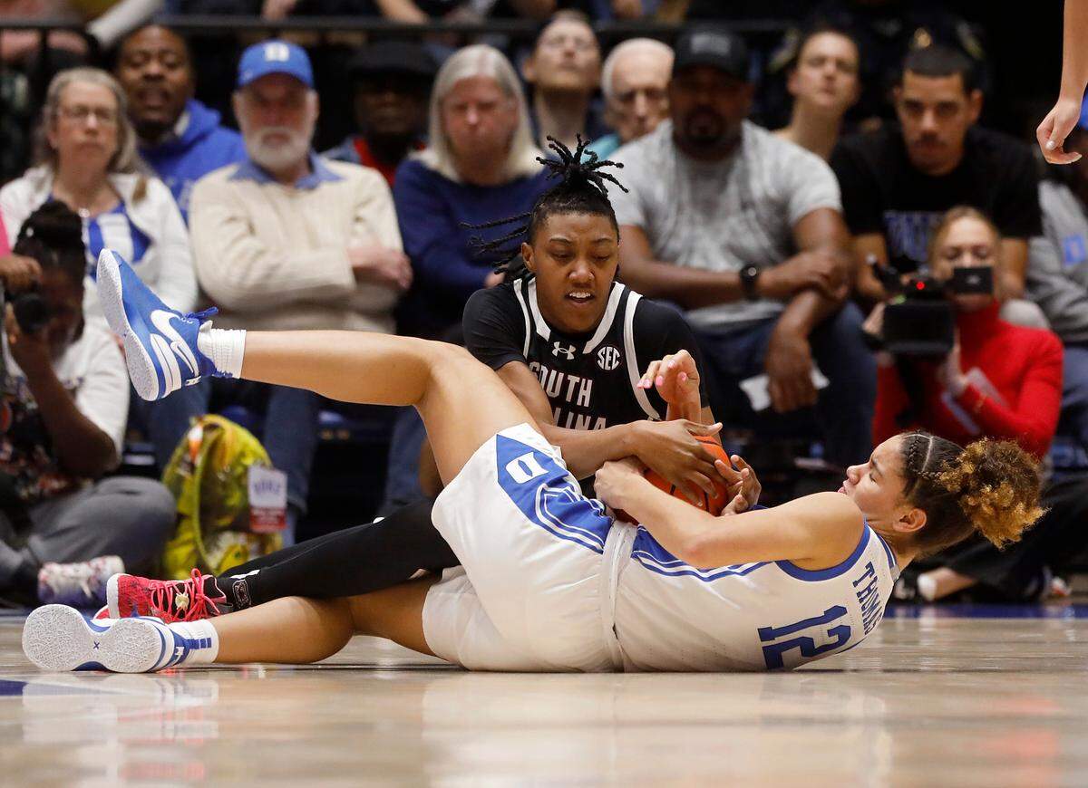 South Carolina’s Ashlyn Watkins and Duke’s Delaney Thomas battle for possession during the first half of the Blue Devils’ 77-61 loss on Sunday, Dec. 3, 2023, at Cameron Indoor Stadium in Durham, N.C.
