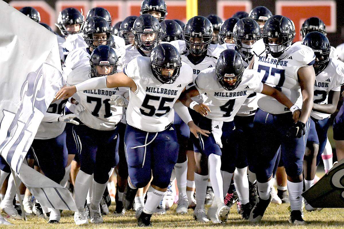 The Millbrook Wildcats rush on the field before their game at Rolesville on October 11, 2024.