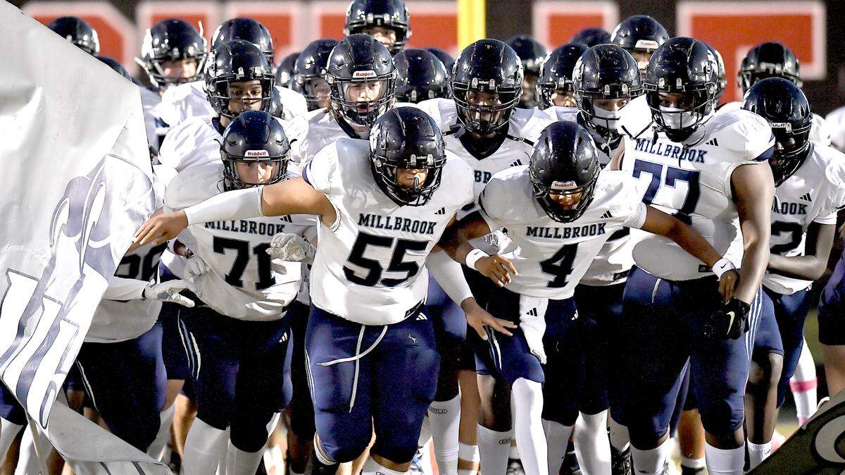 The Millbrook Wildcats rush on the field before their game at Rolesville on October 11, 2024. The Rolesville Rams and the Millbrook Wildcats met in a football game in Raleigh. N.C. on October 11, 2024.