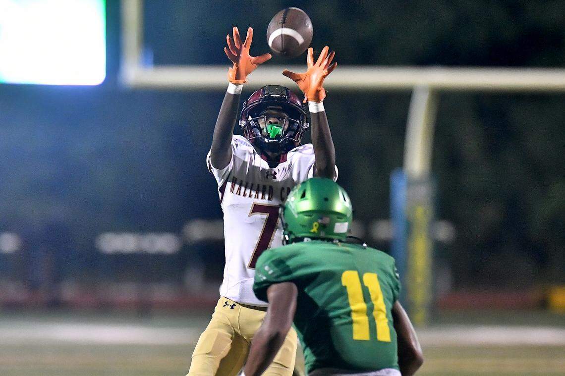 Mallard Creek wide receiver Khalil Price (7) makes the catch on the fourth down against Cardinal Gibbons' Skylar Alston (11) during the fourth quarter. The Mallard Creek Mavericks and the Cardinal Gibbons Crusaders met in a non-conference football game in Raleigh, N.C. September 19, 2025