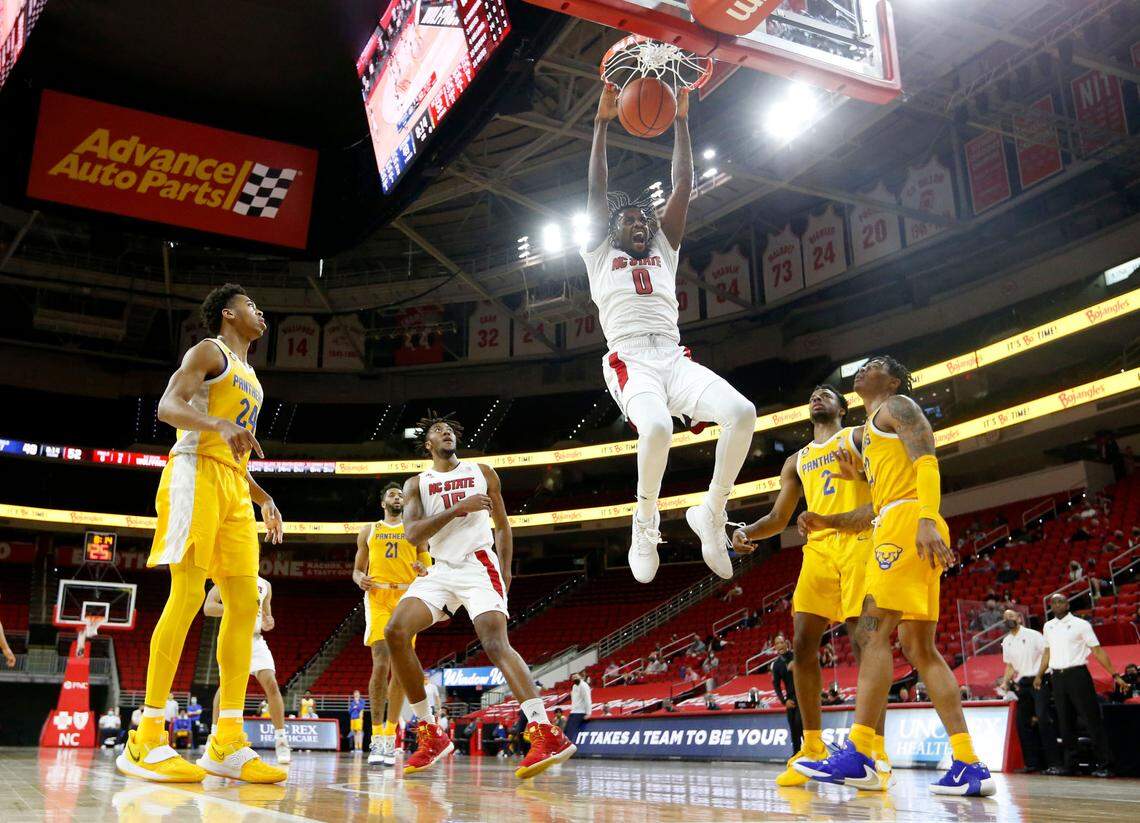 N.C. State’s D.J. Funderburk (0) reacts after slamming in two during N.C. State’s 65-62 victory over Pittsburgh at PNC Arena in Raleigh, N.C., Sunday, February 28, 2021.