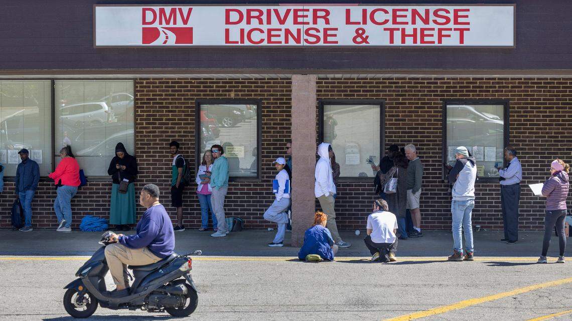 More than 40 people wait in line at the North Carolina DMV Driver’s License Office on Avent Ferry Road on Wednesday afternoon, April 10, 2025 in Raleigh, N.C. Most arrived well before 9 a.m. seeking a spot in the “first come, first served” line. Many said they had been in line multiple days seeking service, since online appointments are booked well into the months ahead.