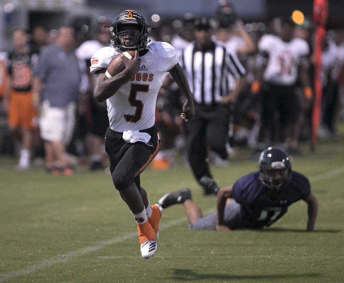 Wallace-Rose Hill’s Kanye Roberts (5) races for a touchdown on the first play from scrimmage against Spring Creek High School on Friday, October 5, 2018 in Seven Springs, N.C.
