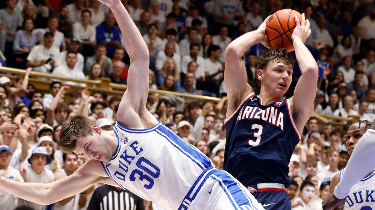 Arizona’s Pelle Larsson (3) pulls in the rebound from Duke’s Kyle Filipowski (30) during the second half of Arizona’s 78-73 victory over Duke at Cameron Indoor Stadium in Durham, N.C., Friday, Nov. 10, 2023.