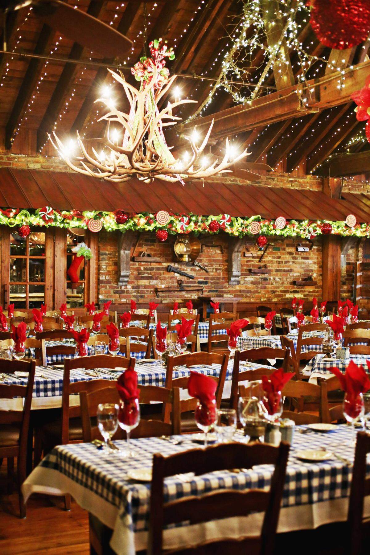 Around the holidays, the large upstairs dining room at the Angus Barn in Raleigh has lights along the ceiling and even includes a large Santa sleigh.
