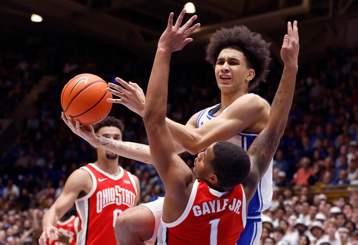 Duke’s Tyrese Proctor (5) is fouled by Ohio State’s Roddy Gayle Jr. (1) during the first half of Duke’s game against Ohio State at Cameron Indoor Stadium in Durham, N.C., Wednesday, Nov. 30, 2022.
