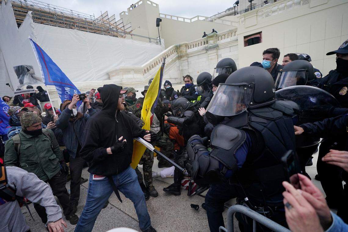 Trump supporters try to break through a police barrier, Wednesday, Jan. 6, 2021, at the Capitol in Washington. As Congress prepares to affirm President-elect Joe Biden’s victory, thousands of people have gathered to show their support for President Donald Trump and his claims of election fraud.