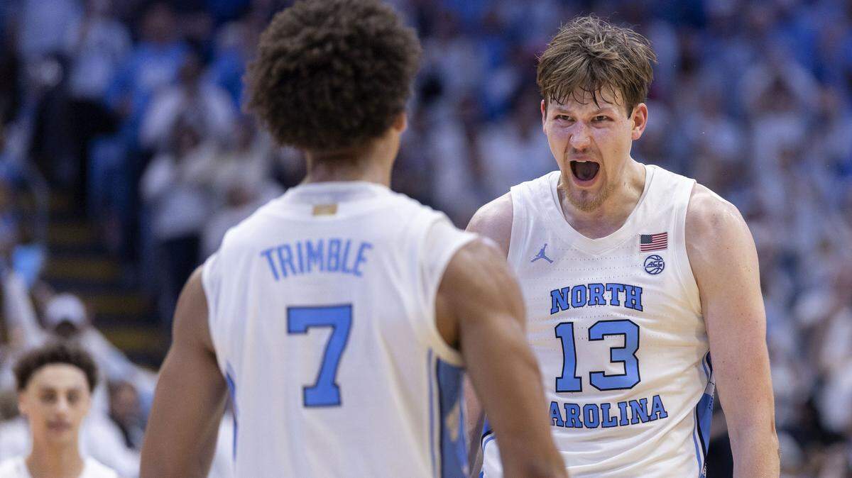 North Carolina center Henri Veesaar (13) and guard Seth Trimble (7) celebrate their 87-74 victory over Kansas on Friday, November 7, 2025 at the Smith Center in Chapel Hill, N.C.