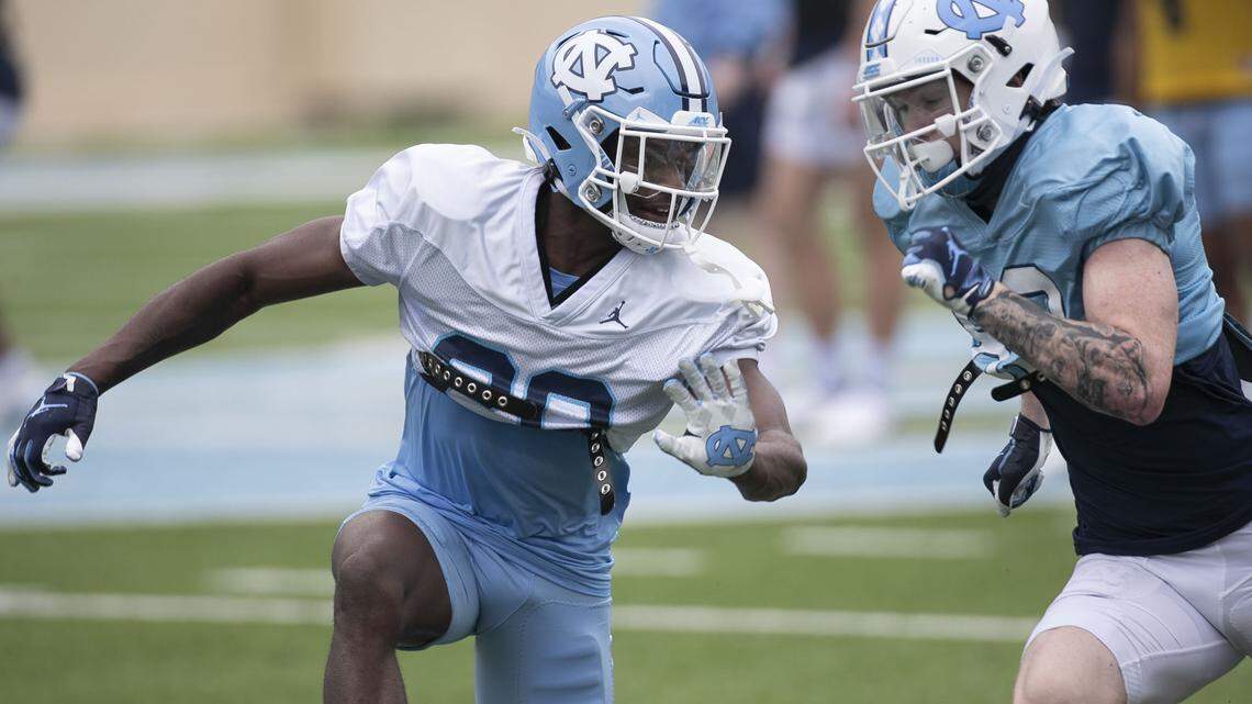 North Carolina defensive back Tony Grimes (20) defends receiver Justin Olson (83) during the Tar Heels’ practice on Saturday, March 27, 2021 at Kenan Stadium in Chapel Hill, N.C.