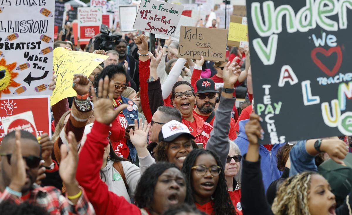 People cheer on the speakers during a rally to protest for more school funding at Halifax Mall in downtown Raleigh, N.C., Friday, May 1, 2026.  The North Carolina Association of Educators has mobilized teachers from across the state to march on the Legislative Building to demand higher pay, more school funding and higher taxes on corporations. 