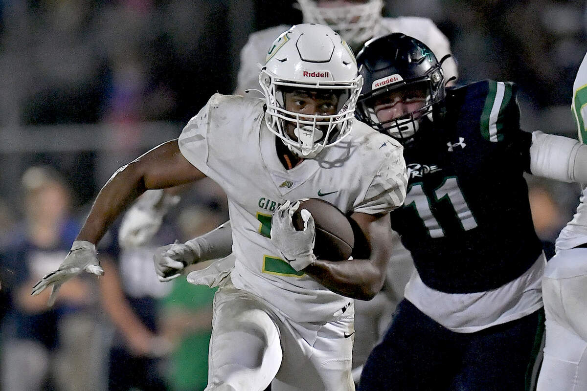 Cardinal Gibbons running back Kendall Scotton (5) runs for yardage against Leesville Road’s Christian Shaw (11) during the second half. The Leesville Road Pride and the Cardinal Gibbons Crusaders met in a conference football game in Raleigh, N.C. on November 1, 2024.
