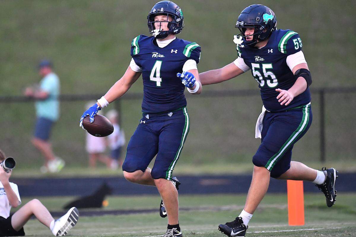 Leesville Road's Sawyer Read (55) celebrates the touchdown by Evan List (4) in the first half against Heritage.  The Leesville Road Pride and the Heritage Huskies met in a  football game in Raleigh, N.C. on September 5, 2025.